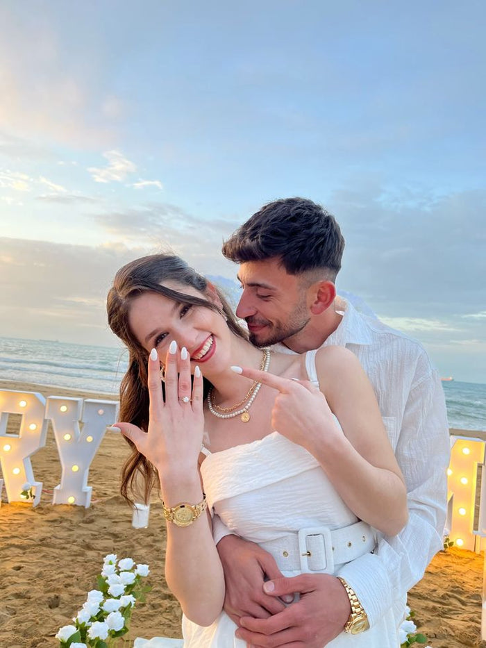 Couple on a beach with ring